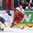 MINSK, BELARUS - MAY 20: Denmark's Morten Madsen #29 stickhandles the puck away from Slovakia's Marek Daloga #8 during preliminary round action at the 2014 IIHF Ice Hockey World Championship. (Photo by Richard Wolowicz/HHOF-IIHF Images)

